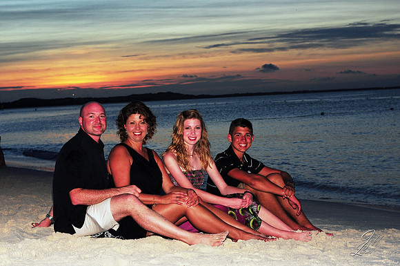 FamilySittingOnBeach